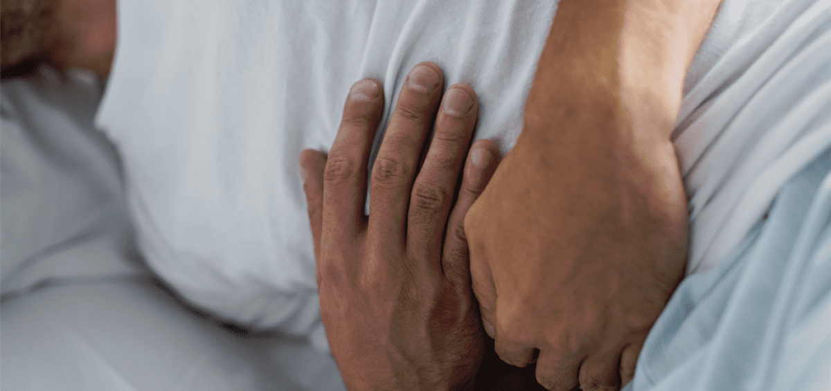 Man suffering from inflammation and stomach pain